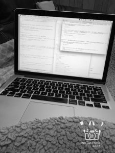 Under my favorite cozy blanket, coding. One of my favorite sick day activities.